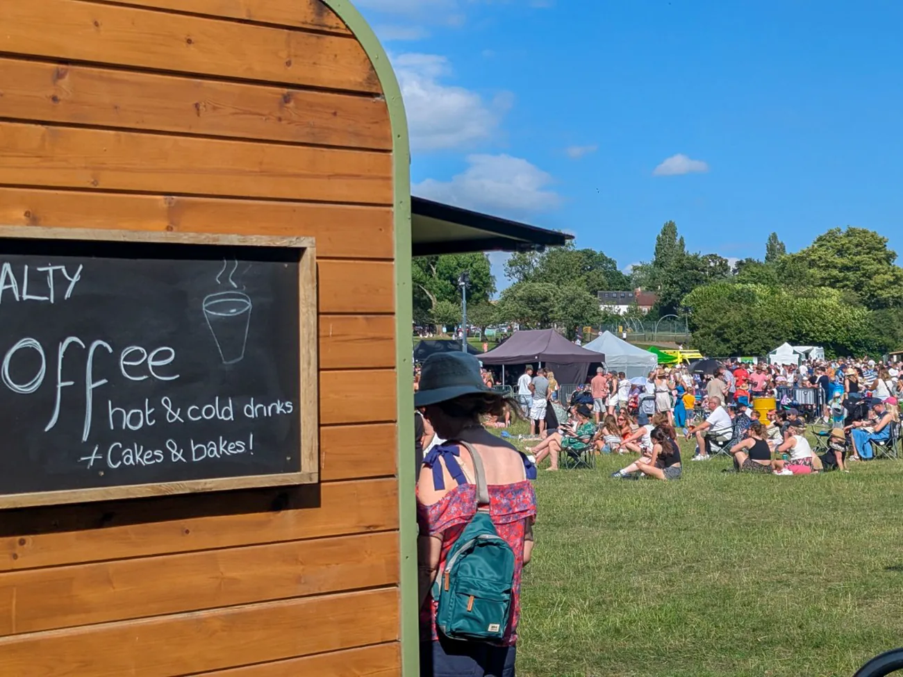 The Gallop & Grind horsebox pitched on grass at a busy outdoor event with visitors queueing at the hatch