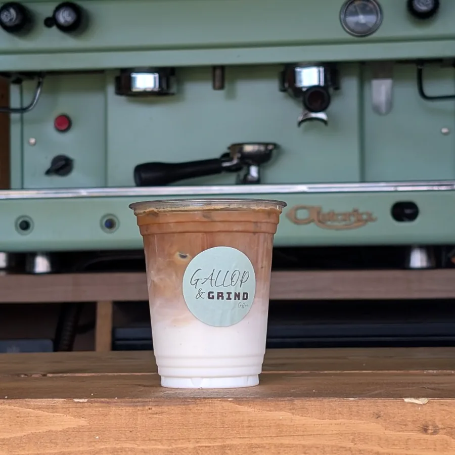 The Astoria lever espresso machine mid-service inside the horsebox