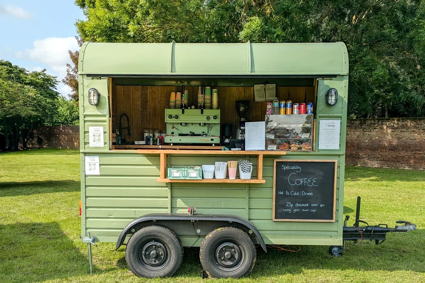 The Gallop & Grind horsebox pitched in an open field with no power or water hook-up