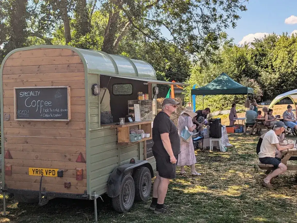 Gallop & Grind coffee trailer serving at a busy outdoor public event.